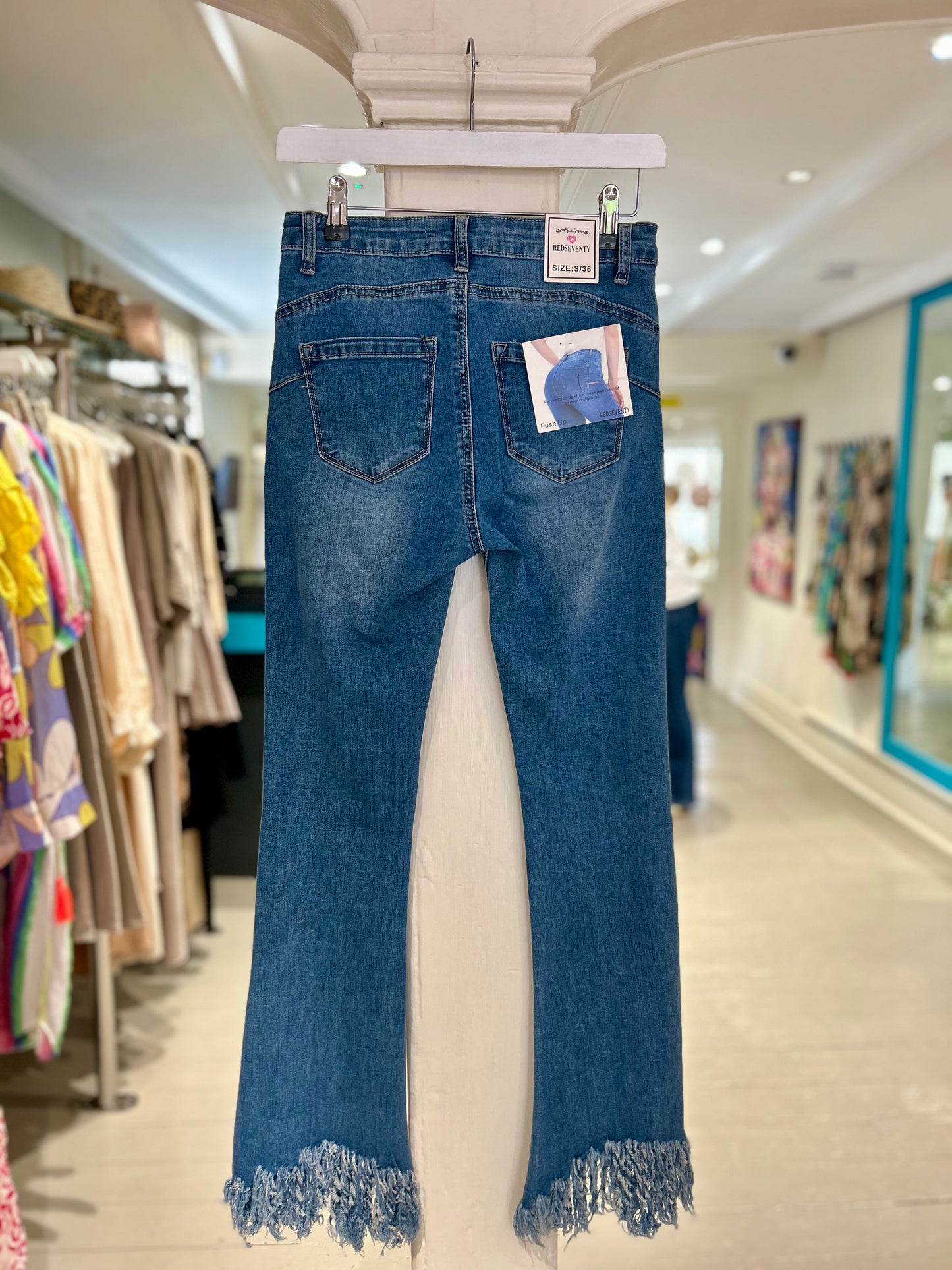 High Waisted Flared Jeans with Distressed Ankles - Mid Wash
