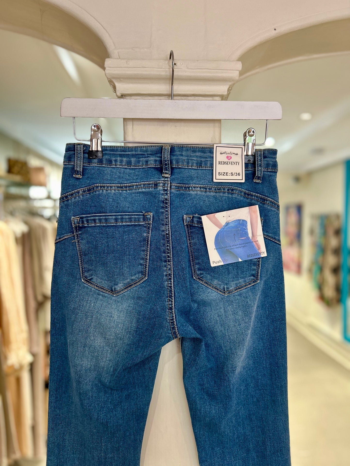 High Waisted Flared Jeans with Distressed Ankles - Mid Wash